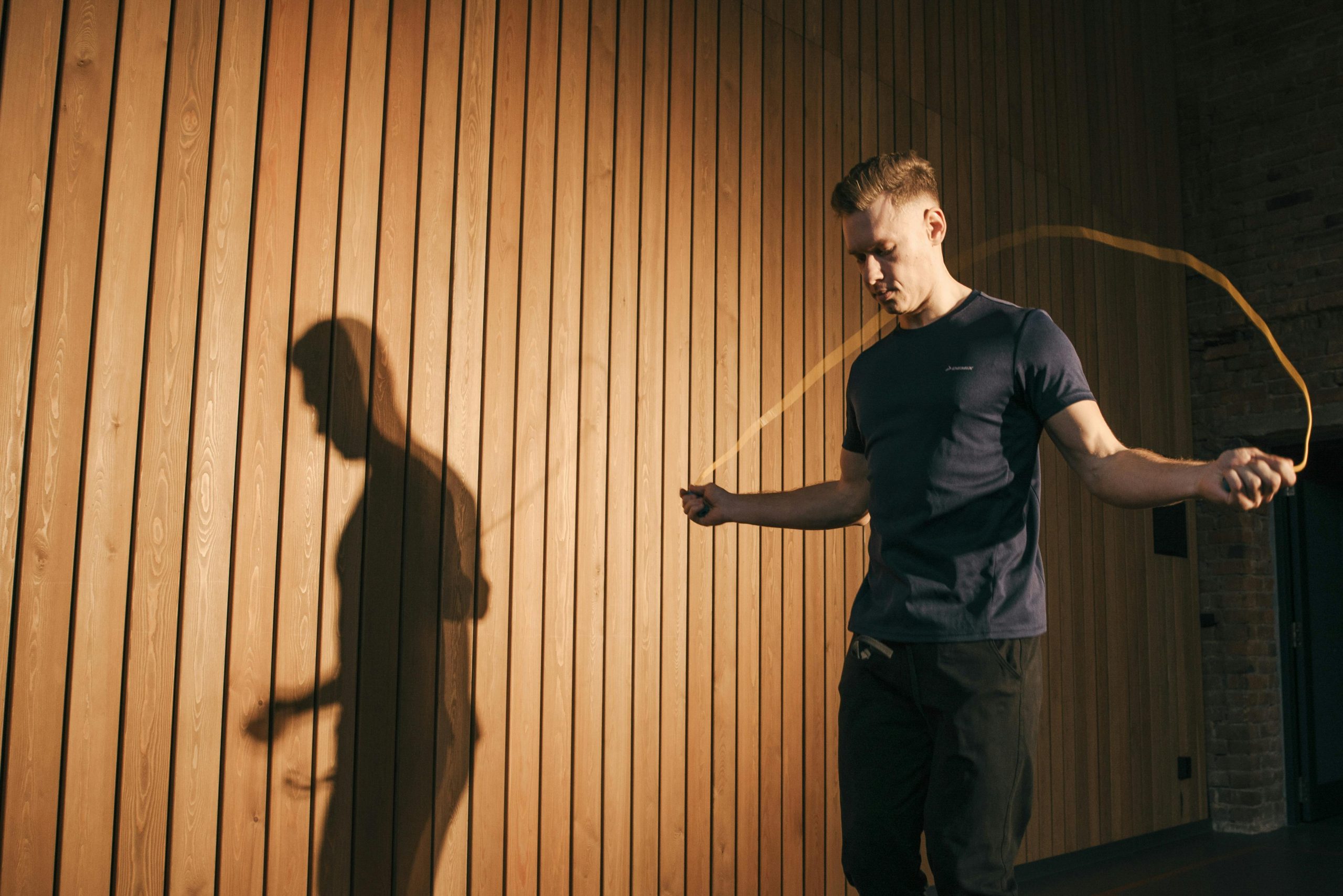 man exercising with a jump rope